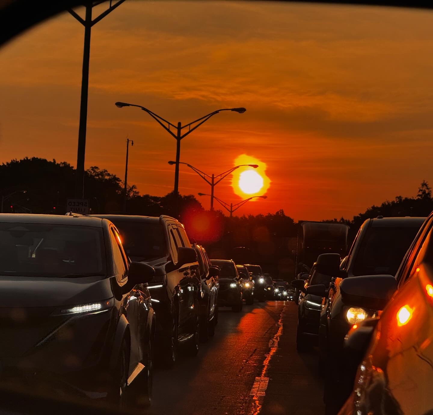 Sunset photographed in side view car mirror
